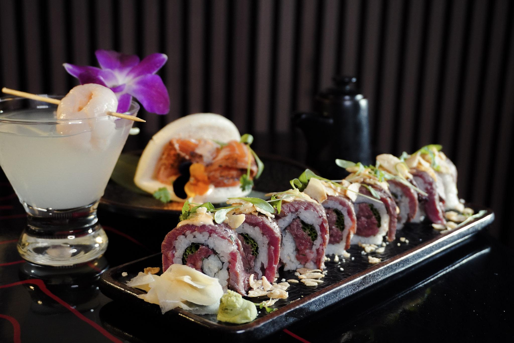 Beef sushi roll with cocktails and bao.