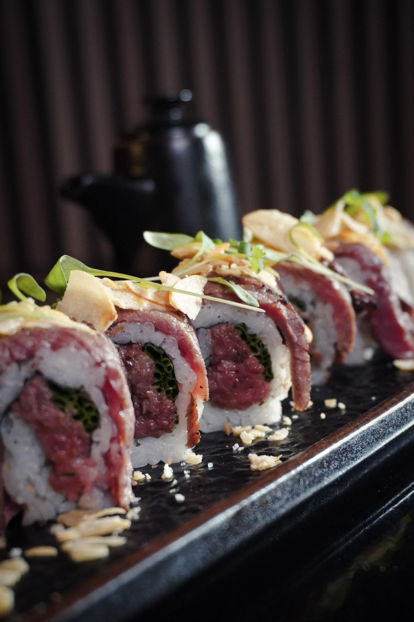 Wagyu beef sushi roll closeup.