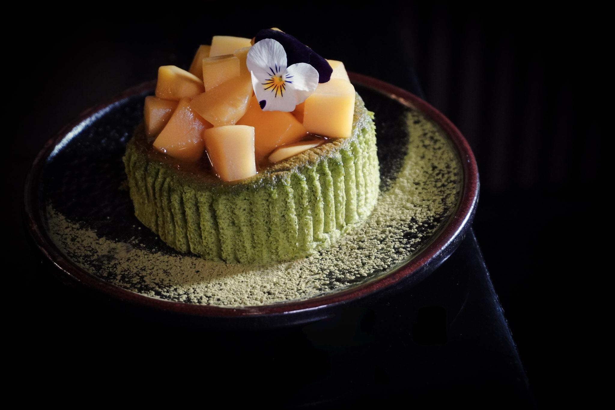 Matcha cake with mango and pansy.