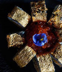 Tokyo Gold Roll with shrimp tempura, eel, tuna, ikura, and 24K gold leaf